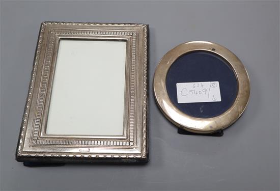 Two modern silver mounted photograph frames including circular, largest 18cm.